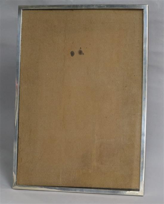 A George V silver mounted rectangular photograph frame, E. Mander Ltd, Birmingham, 1935, 36.9cm.